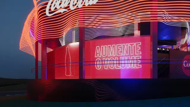 O espaço Coke Studio: Painel Aumente o Volume com o contorno da garrafa, à noite